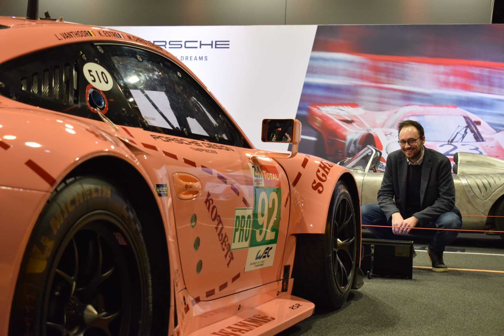 Sander Vanrapenbusch beside a Porsche 911 RSR Le Mans race car